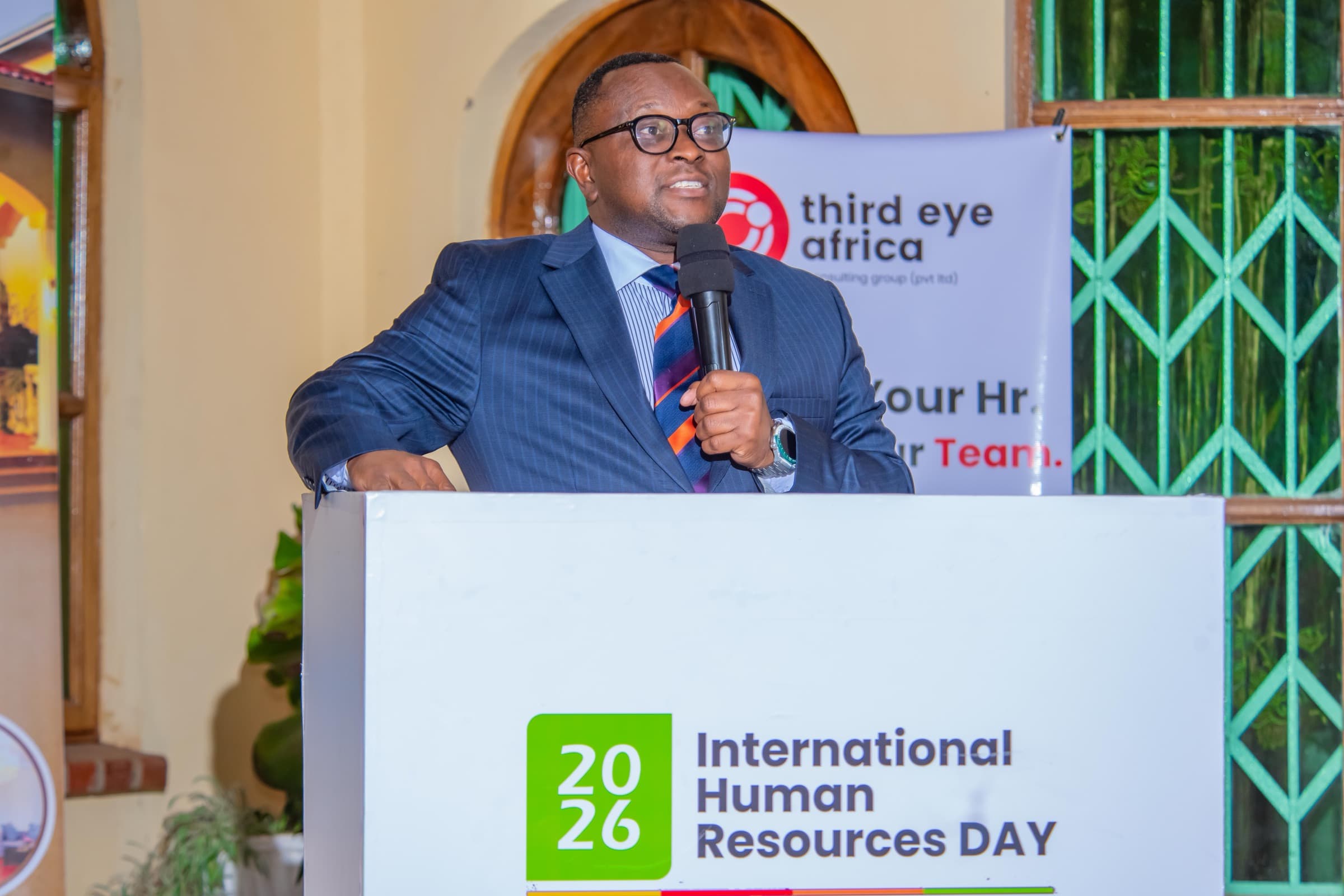 A 3rd Eye Africa speaker delivering a keynote at the International Human Resources Day 2026 podium